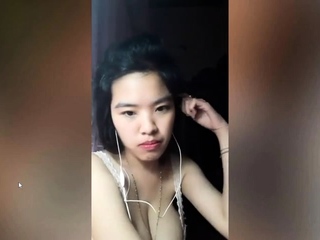 Vietnam brunette bares her big boobs to play with them